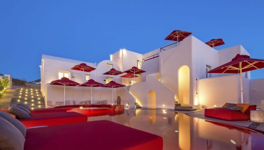 A hotel pool colored in Red, breaks the rules in the Cyclades!